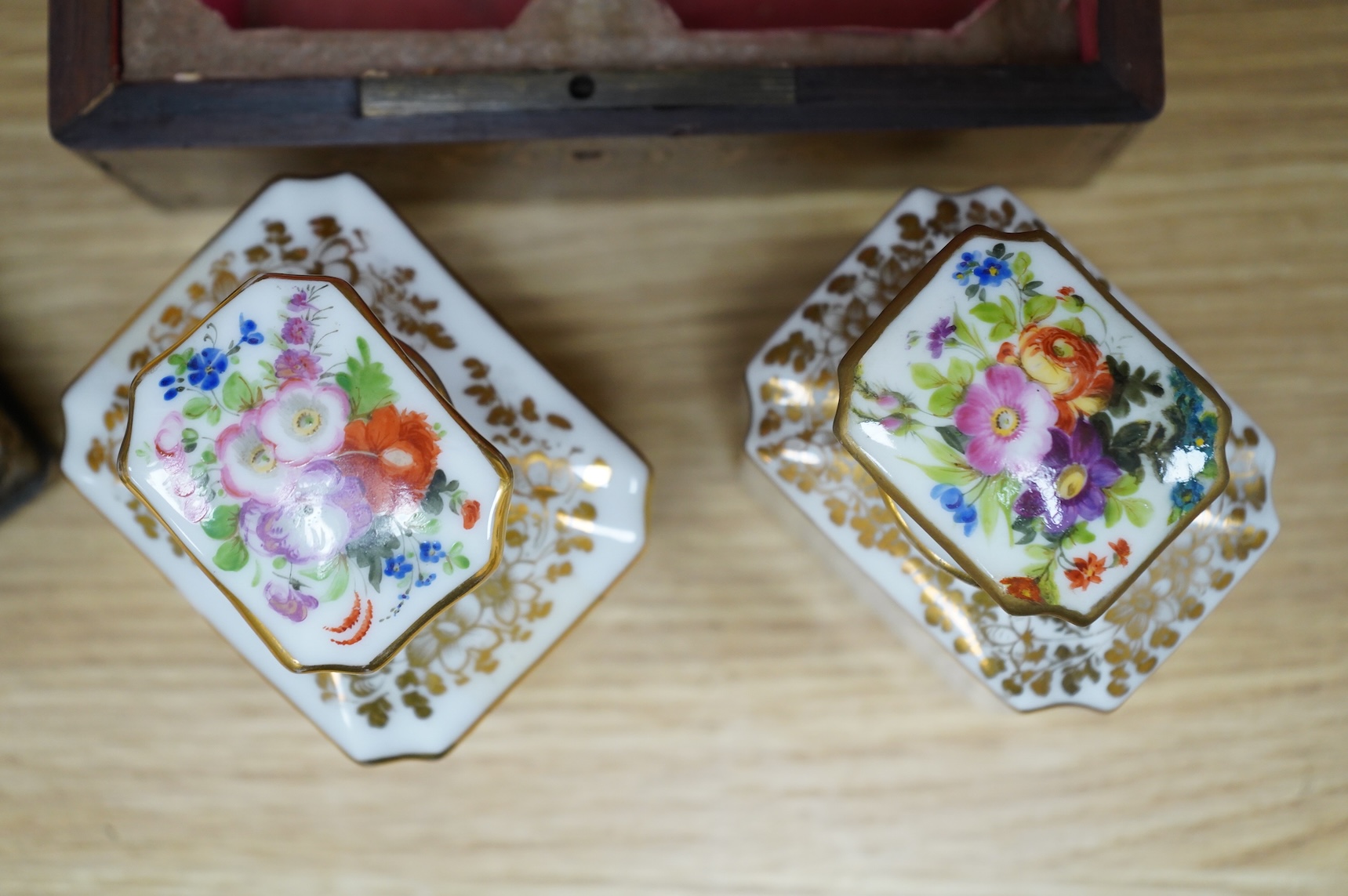 Four boxes to include a burr elm bound example, together with a French inlaid ‘Thé’ caddy with porcelain canisters, largest 32cm wide